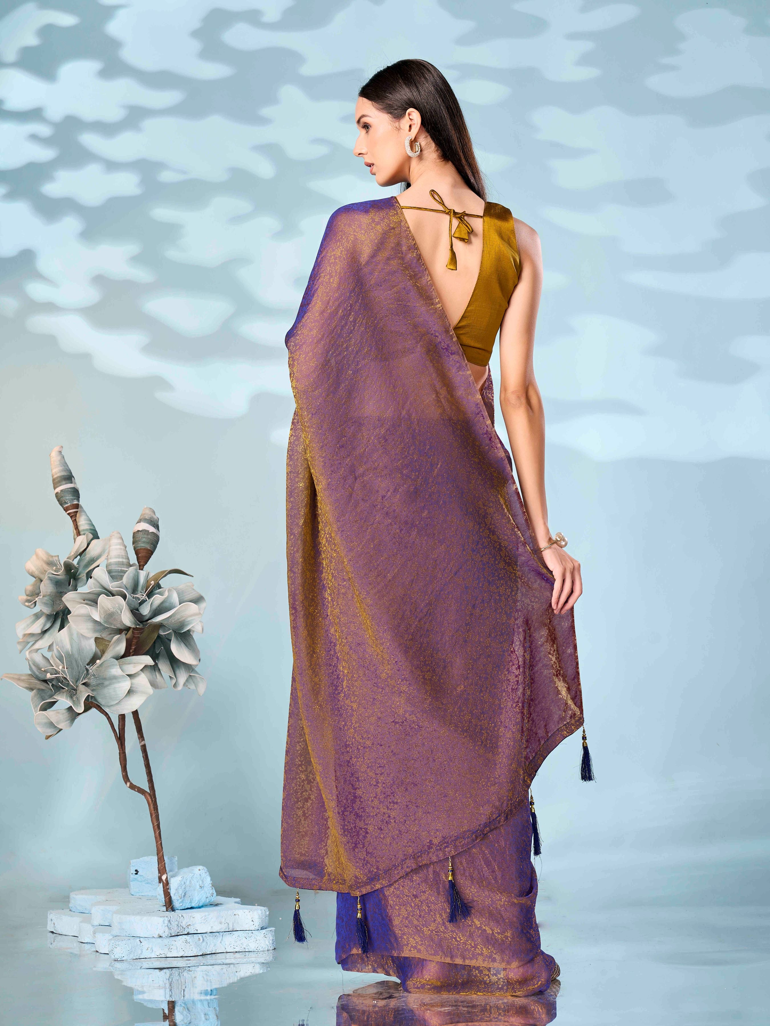 Two tone purple and mustard colored woven saree with tassles on pallu